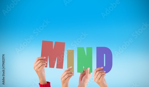 Composite image of hands holding up mind