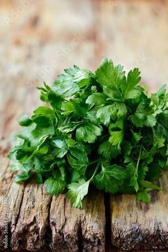 Fresh parsley on wooden surface