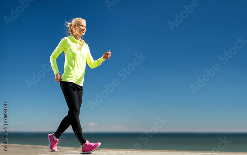 woman doing sports outdoors photo