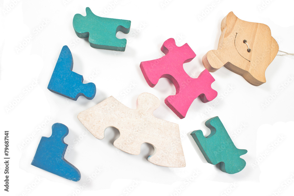 Colorful wooden girl puzzle pieces isolated on white Colorful wooden girl puzzle pieces isolated on white