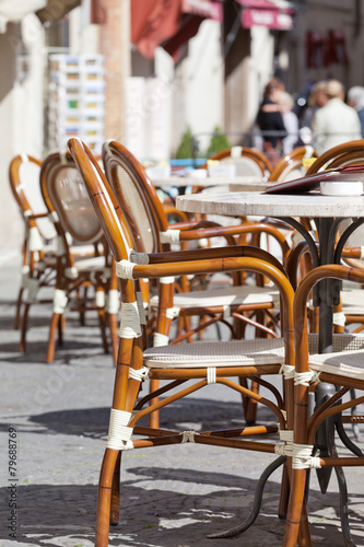 tables and chairs in small street cafe in Europe