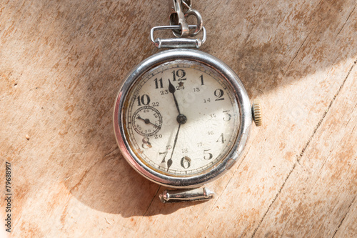 Vintage watch on a wooden background.