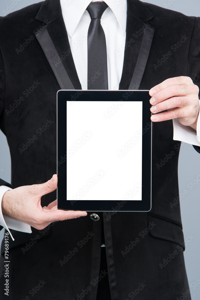 Businessman holding digital tablet pc with blank screen Businessman holding digital tablet pc with blank screen