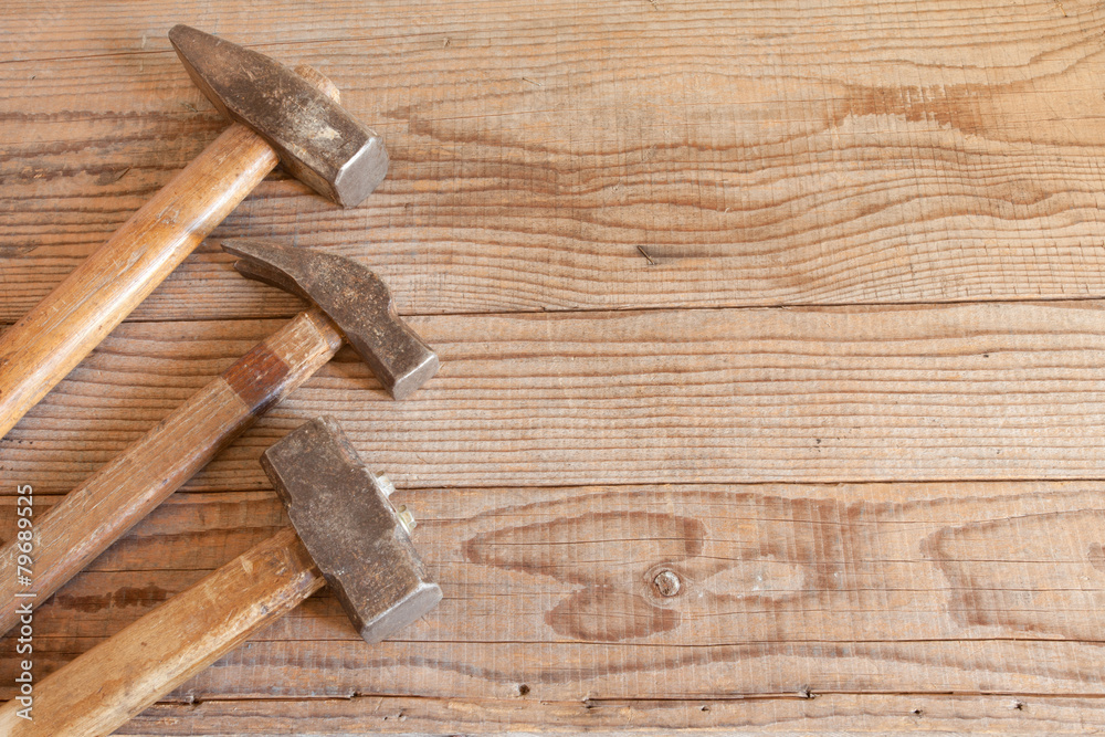 Hammers set on wooden background