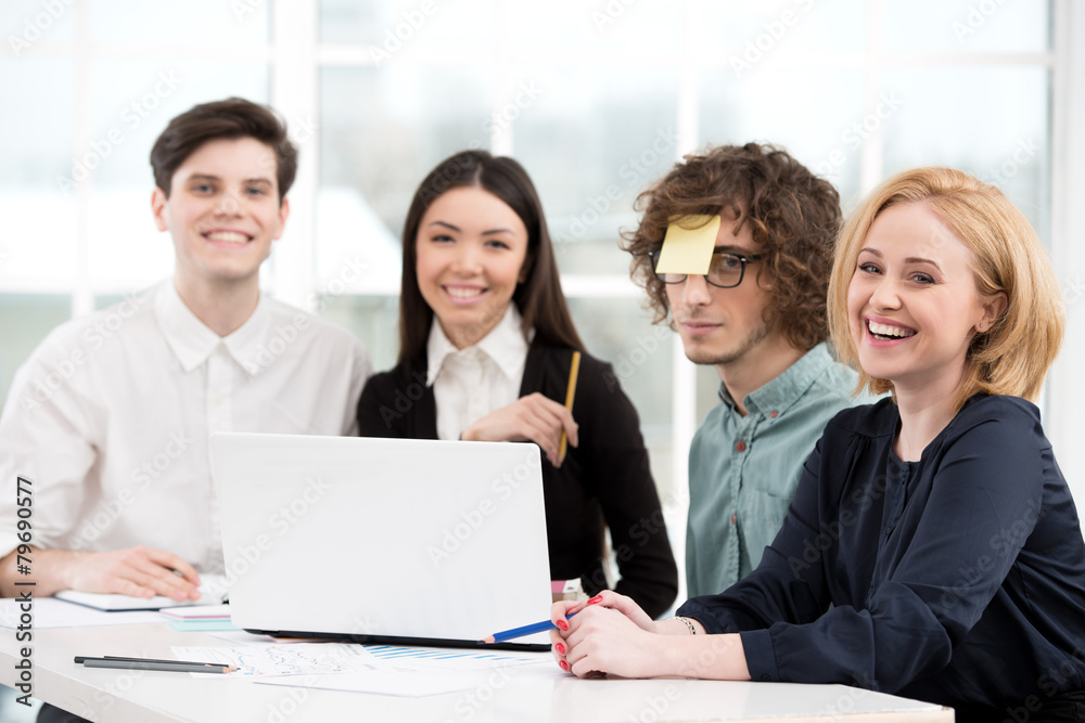 Business team working with laptop in office Business team working with laptop in office