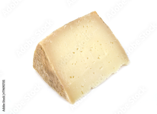Delicious wedge of spanish machego cheese on a white background