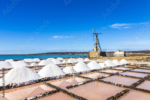 salt piles in the saline of Janubio in Lanzarote with old toteen photo