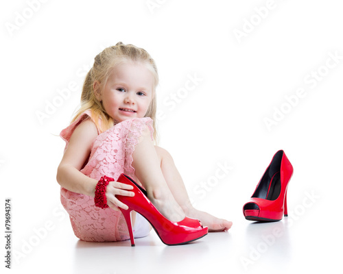 Little girl trying on mummy...