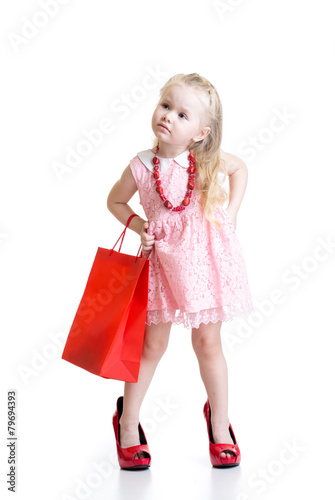 Funny little girl trying on...