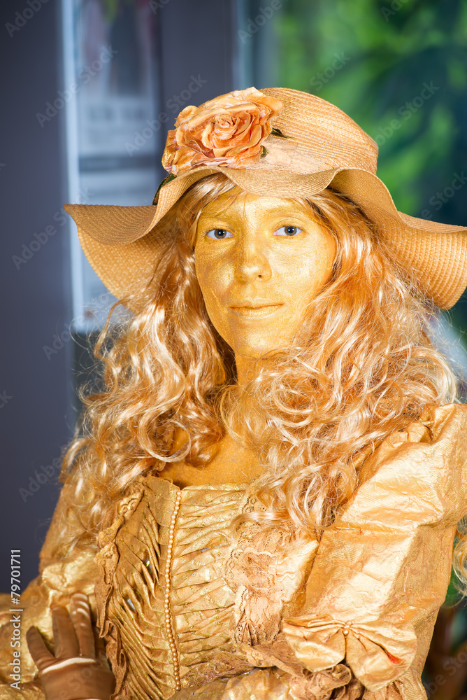 Pretty golden woman in past century style