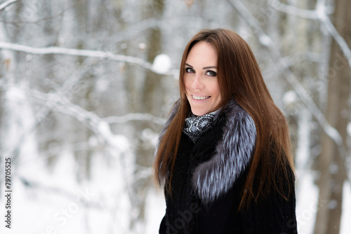 Woman in winter forest