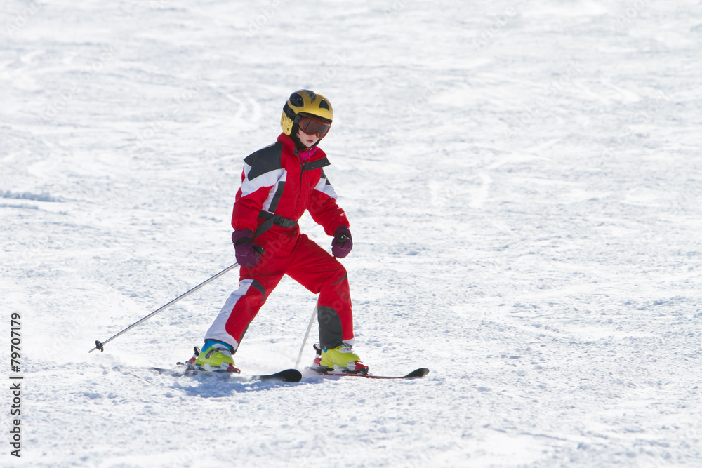 Little girl skiing downhil