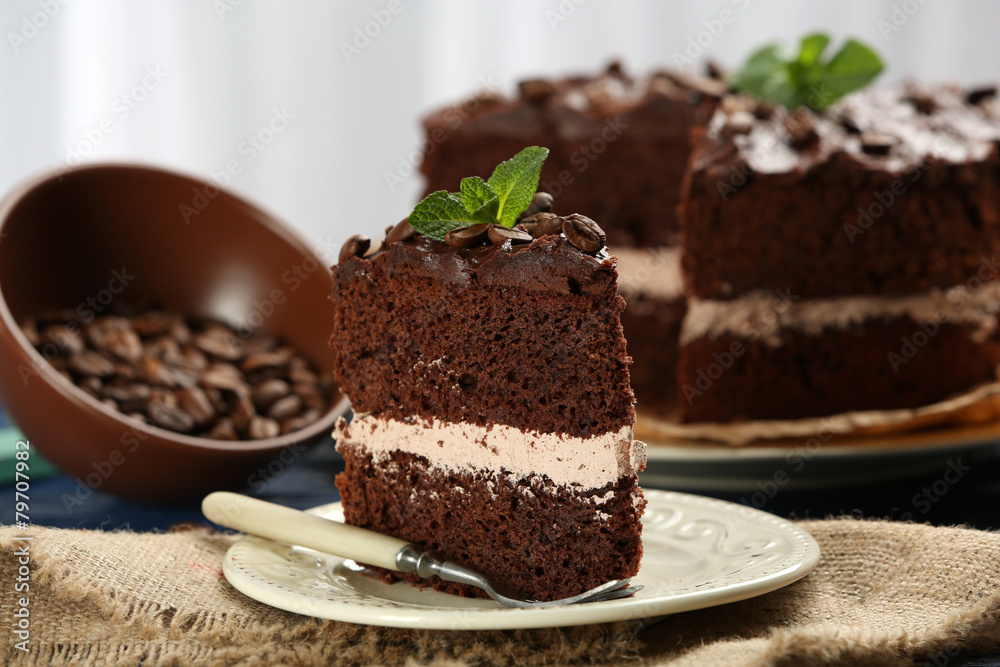 Delicious chocolate cake on table on light background Delicious chocolate cake on table on light background