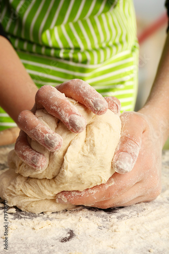 Making dough by female hands