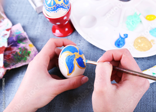 Painting Easter eggs by female hands