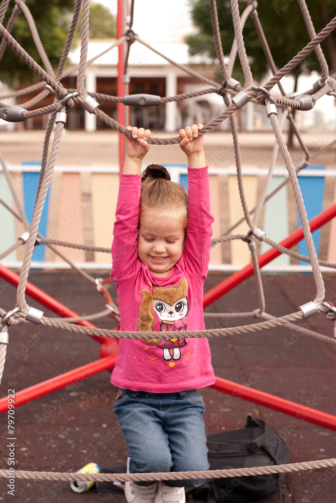 The beautiful girl play on the playground The beautiful girl play on the playground