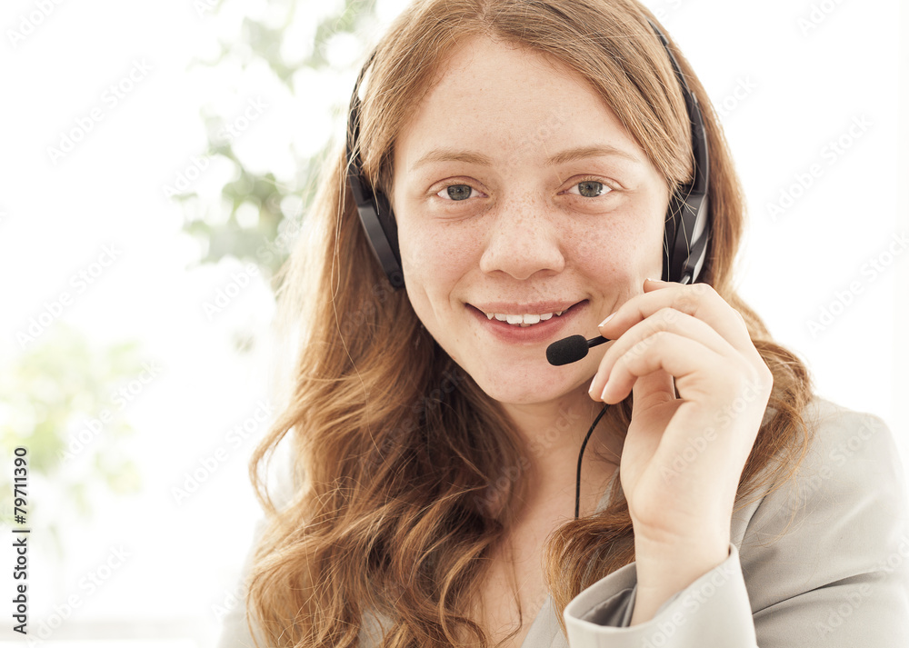 Portrait of happy young female with headset Portrait of happy young female with headset