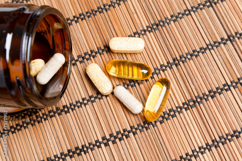 Multivitamin Pills in a brown medicine jar