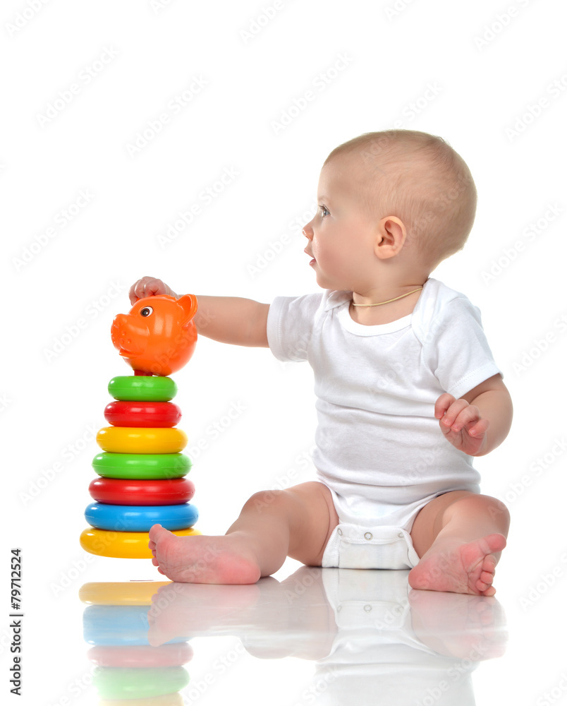 Infant child baby boy toddler playing with Pyramid in hand Infant child baby boy toddler playing with Pyramid in hand