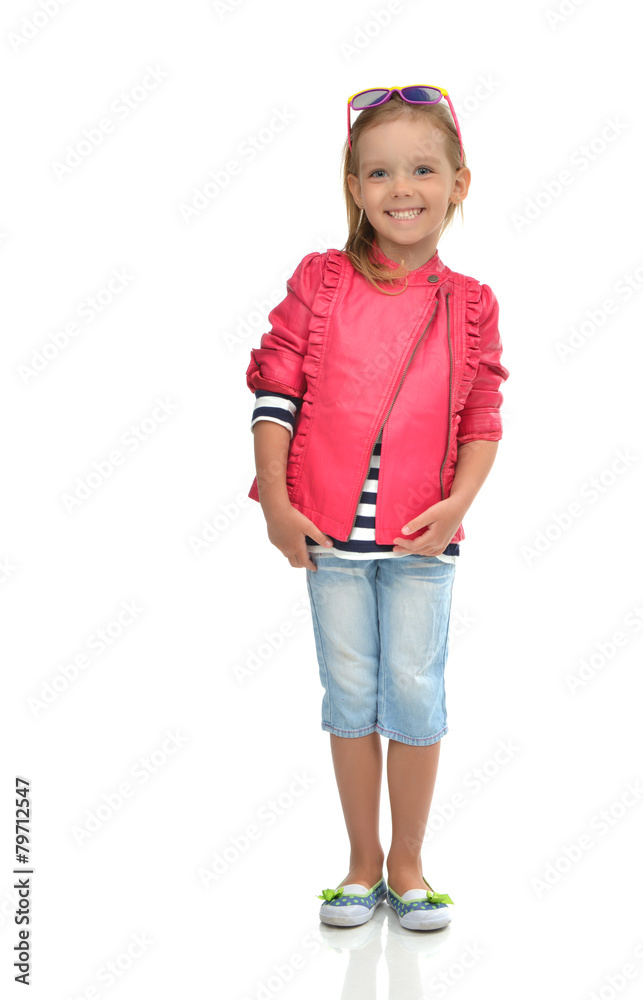 A portrait of laughing fashion little girl full body standing in A portrait of laughing fashion little girl full body standing in