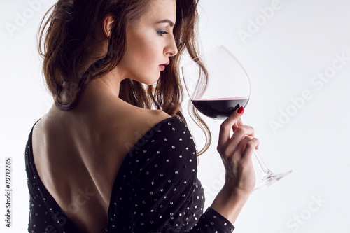 Beautiful young woman with wine glass