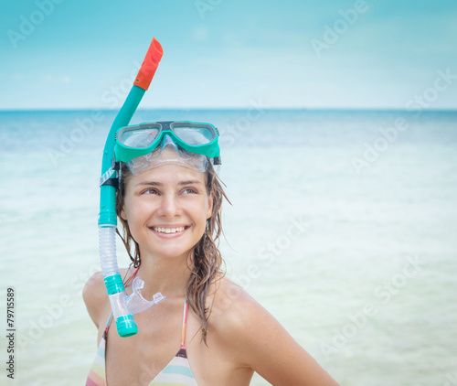 woman with a mask for snorkeling in the sea background