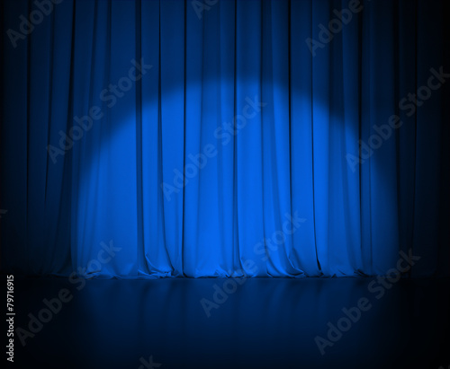 theatre dark blue curtain or drapes with light spot