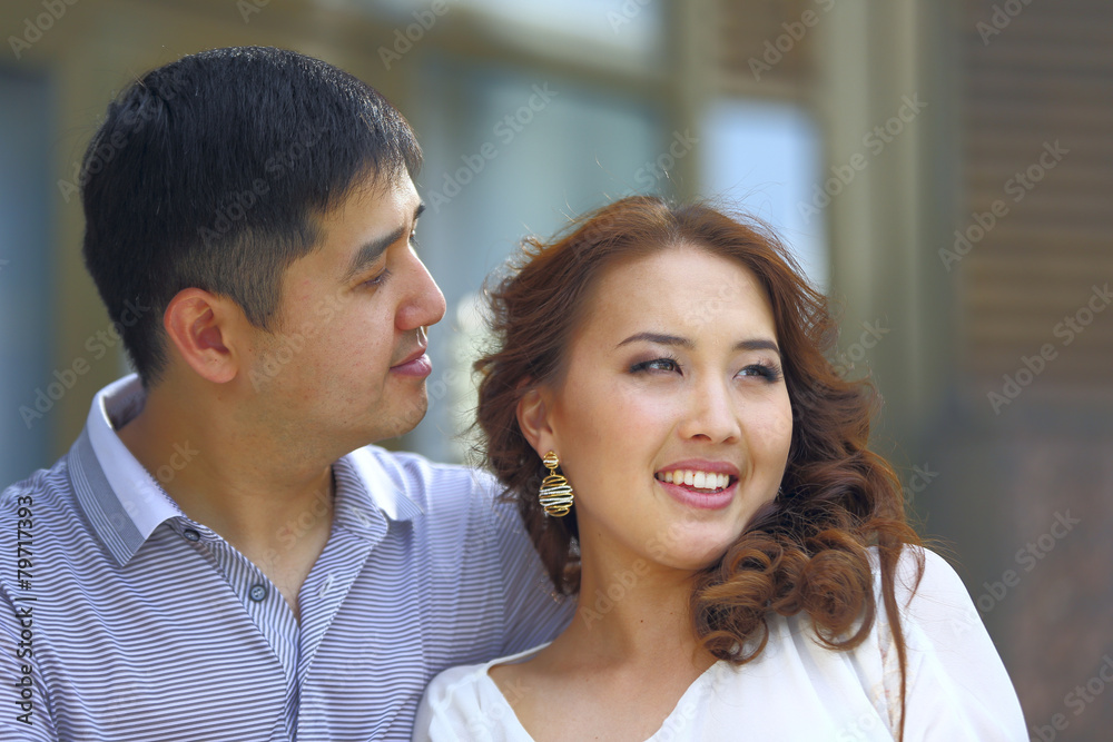 Asian couple together looking to future Asian couple together looking to future