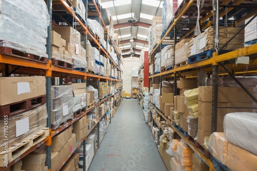Schilderij op canvas Shelves with boxes in warehouse
