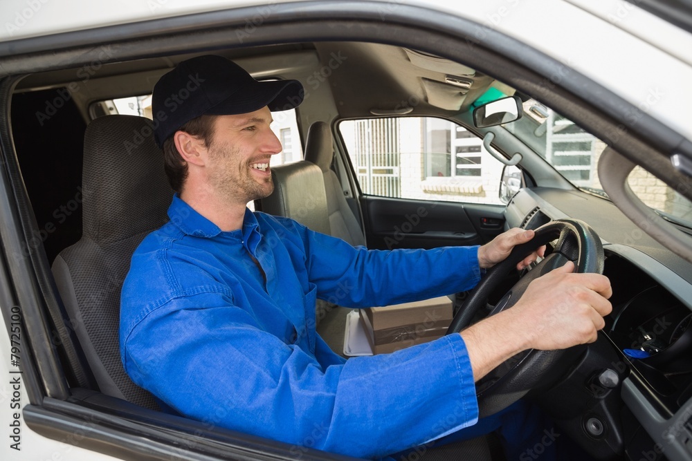 Delivery driver smiling in his van Delivery driver smiling in his van