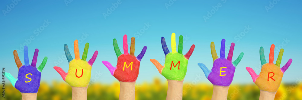 Obraz premium Kid's painted hands against blue sky
