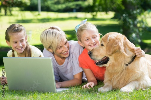 Happy family looking at their dog © WavebreakmediaMicro