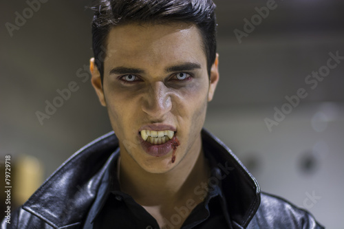 Young Vampire Man Face with Blood on his Mouth