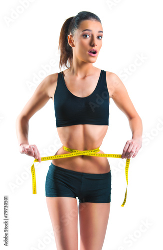Beautiful woman with a tinny waist and a measuring tape © Tijana