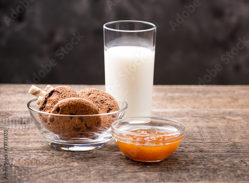 Breakfast with milk and cookies on wooden table
