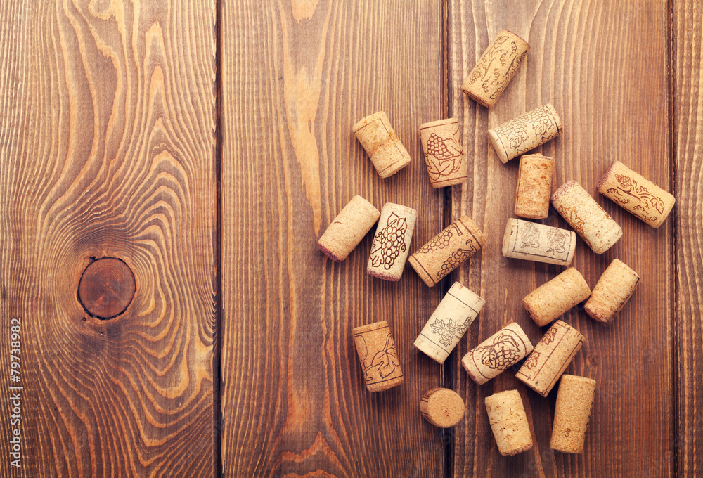 Wine corks over rustic wooden table background Wine corks over rustic wooden table background