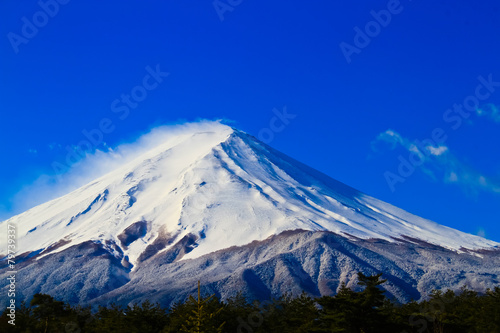Close up of sacred mountain of Fuji on top covered with snow in