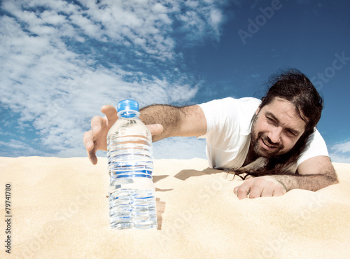 Thirsty man reaching for a bottle of water