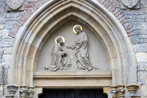 Obraz na płótnie Sculpture above entrance of St. Peter Church Na Porici, Prague.