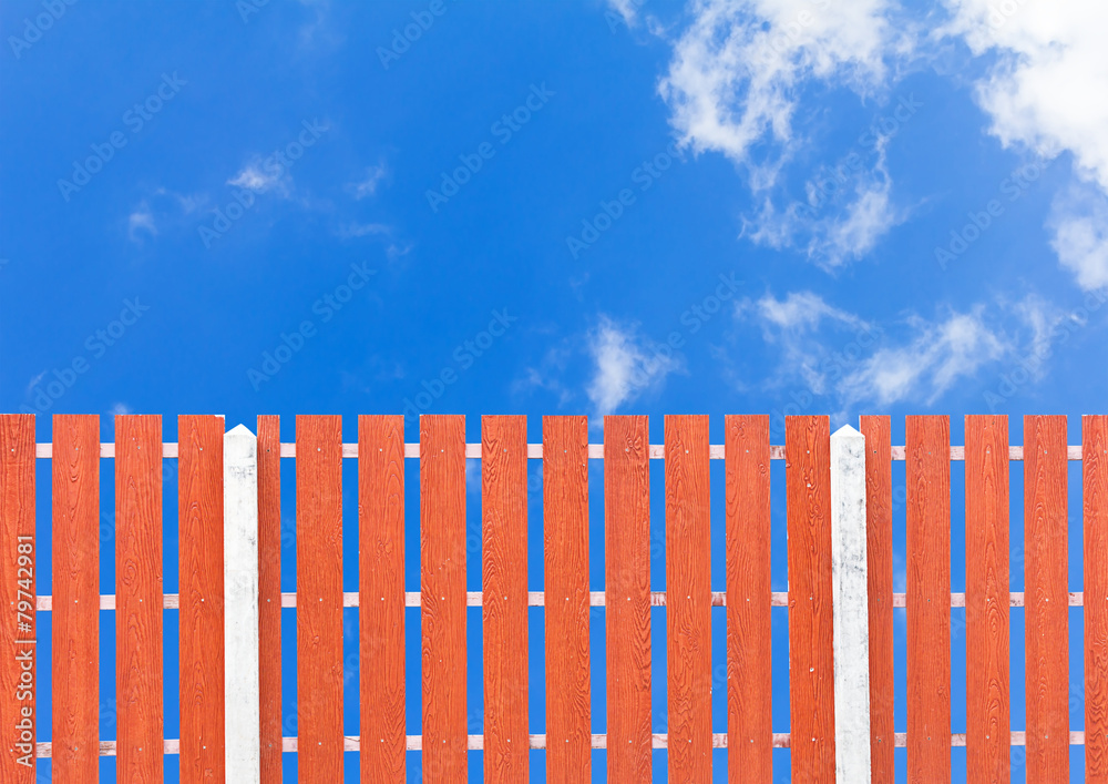 Wooden fence and blue sky with cloud