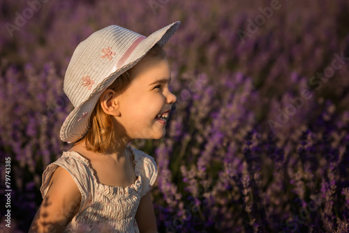 Beautiful little girl on the background of a lavender field