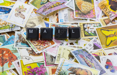 words on cubes against the background of the old postal stamps