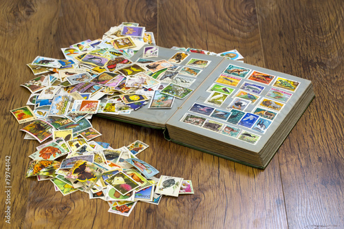stamps with old album on the table
