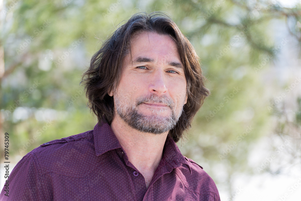 Portrait of a middle-aged man in nature