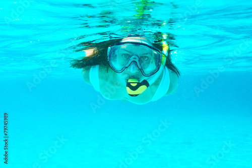 Woman with mask snorkeling © haveseen