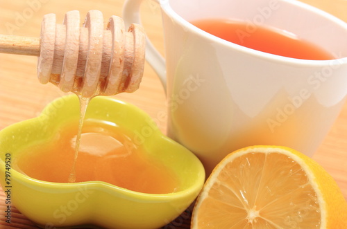 Cup of healthy tea with honey and lemon