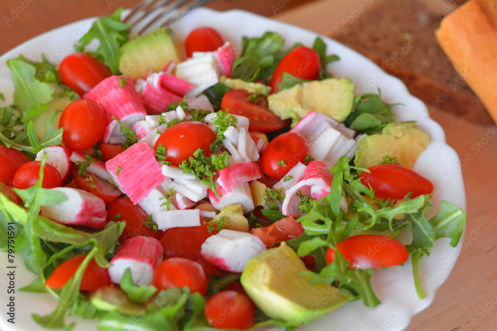 Mixed vegetable salad with crab sticks and avocado Mixed vegetable salad with crab sticks and avocado