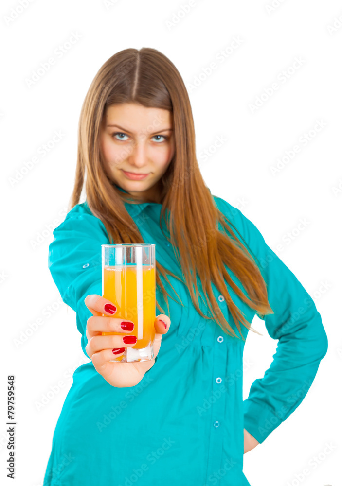 Portrait of a beautiful young woman with a glass of orange apple Portrait of a beautiful young woman with a glass of orange apple