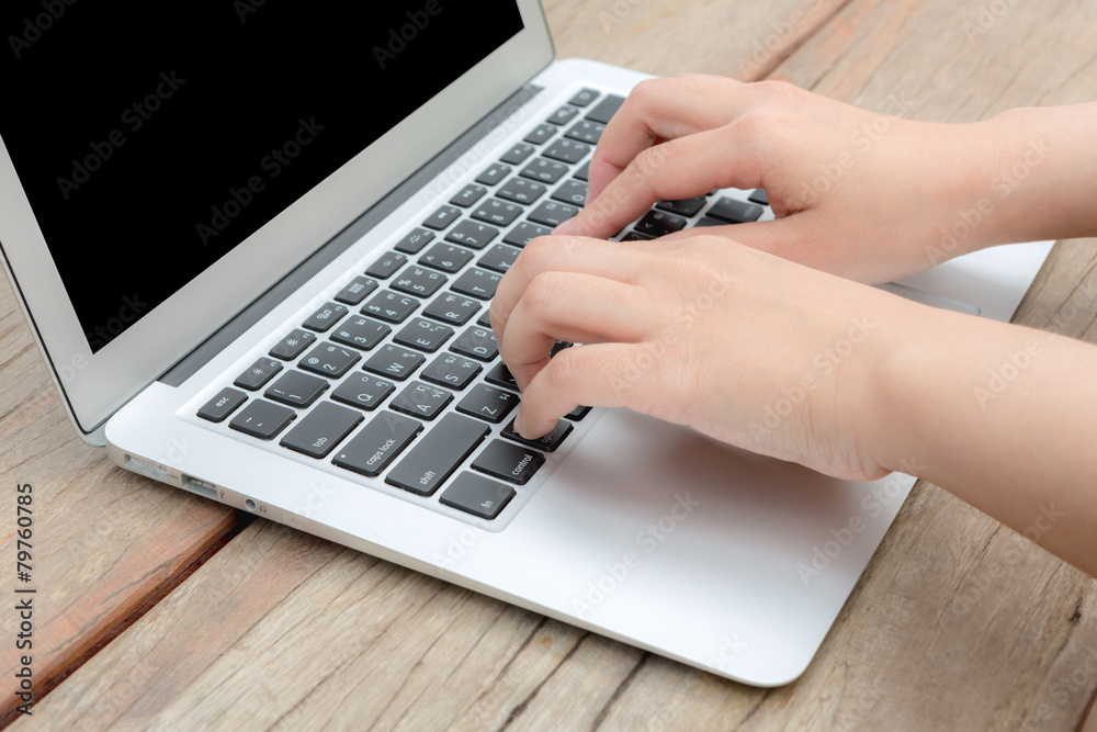 Closeup of business woman hand typing on laptop keyboard Closeup of business woman hand typing on laptop keyboard