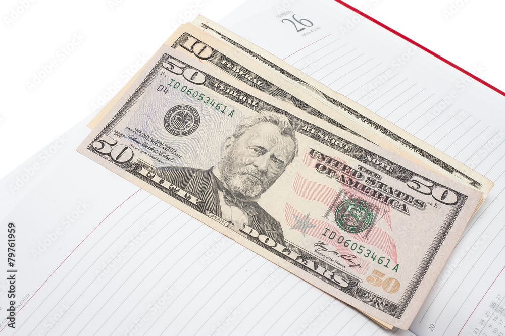 Notepad and money. Background image for finance and banking Notepad and money. Background image for finance and banking